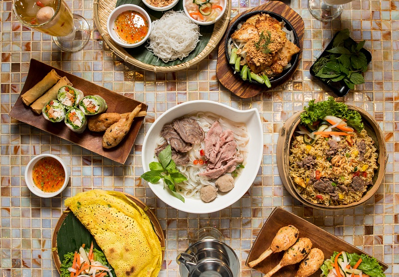 A dining table full of vietnamese food